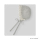 Capota de punto para bebé en color perla/beige. Colección Balancín, marca Paz Rodríguez. Colección Invierno 2024.